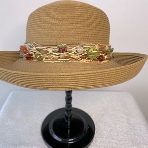 Packable tan sunhat with sea glass accent.